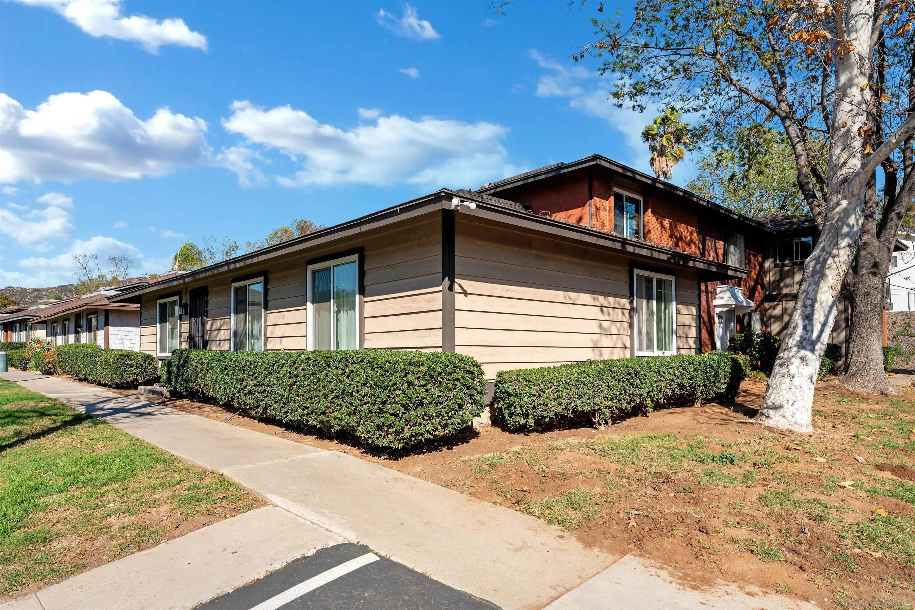 1622 Summertime Drive El Cajon, CA 92021 - Photo 24 of 27 a front view of a house with a garden