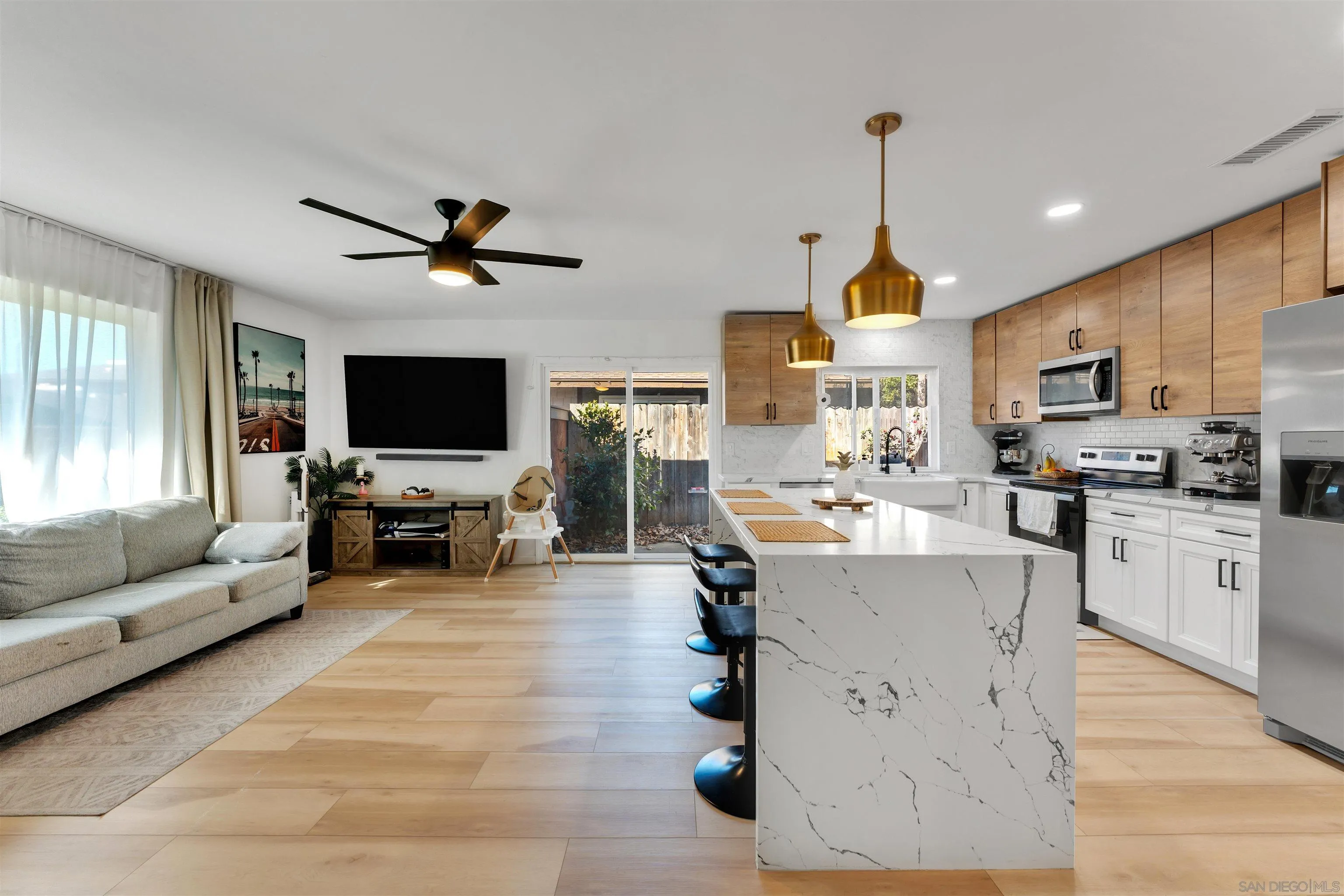 1622 Summertime Drive El Cajon, CA 92021 - Photo 7 of 27 a living room with furniture kitchen view and a flat screen tv