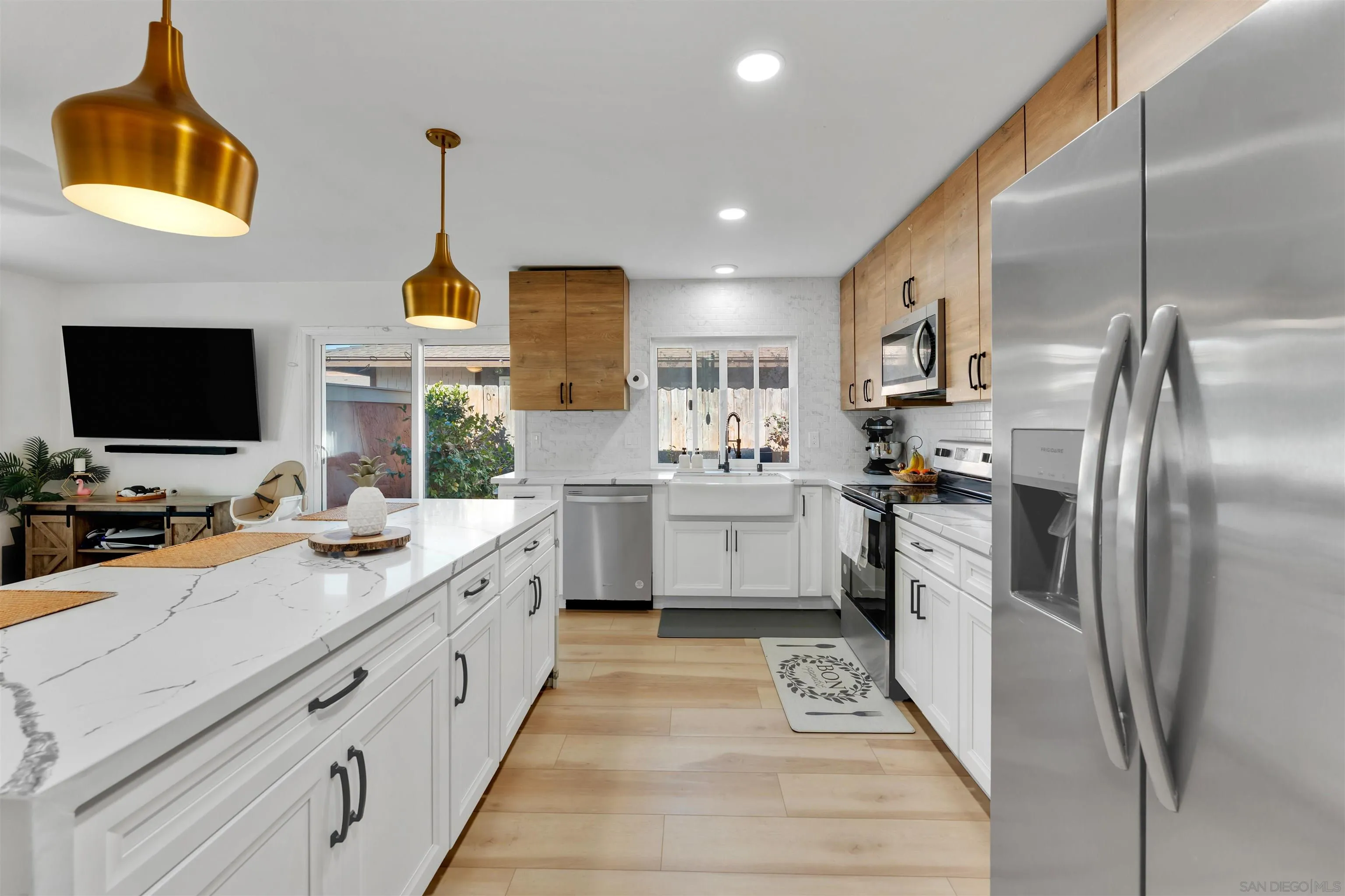1622 Summertime Drive El Cajon, CA 92021 - Photo 10 of 27 a kitchen with a sink stainless steel appliances and counter space