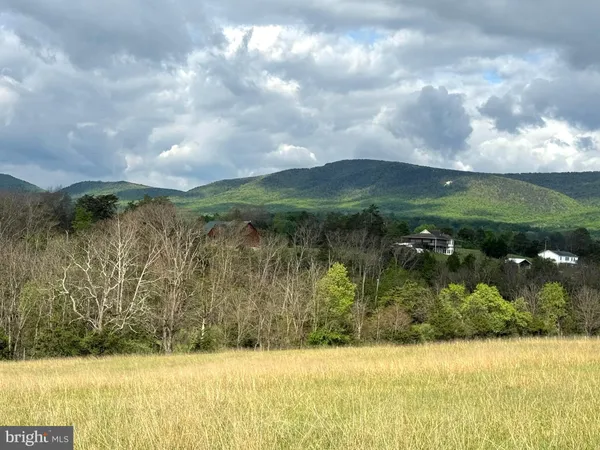 a view of a lake with a yard