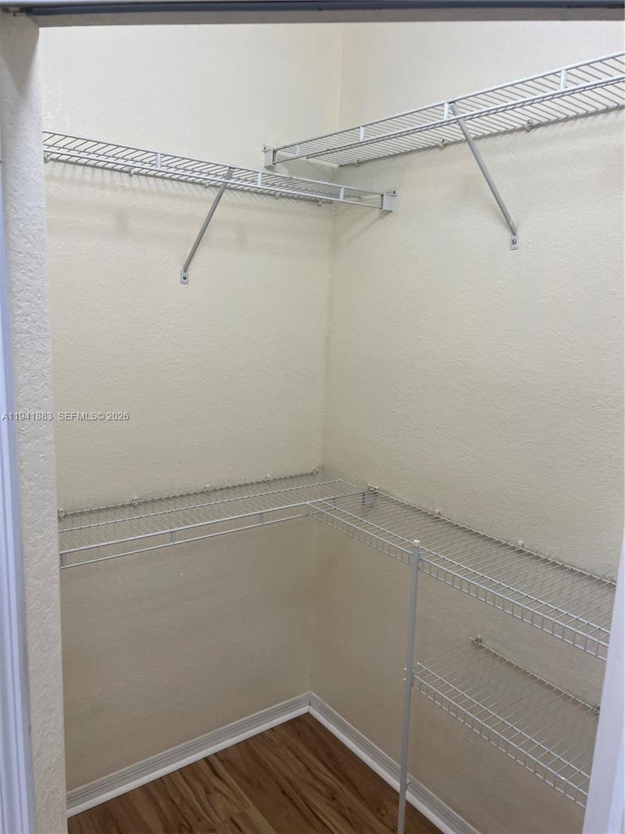 1055 South Hiawassee Road, Unit 2014 Orlando, FL 32835 - Photo 15 of 22 a view of a room with racks on the wall