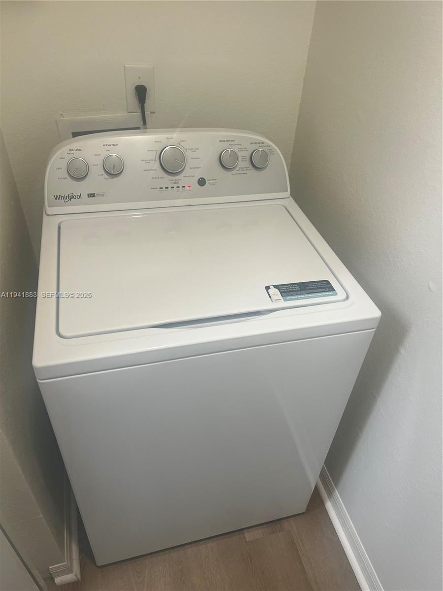 1055 South Hiawassee Road, Unit 2014 Orlando, FL 32835 - Photo 22 of 22 a utility room with washer and dryer