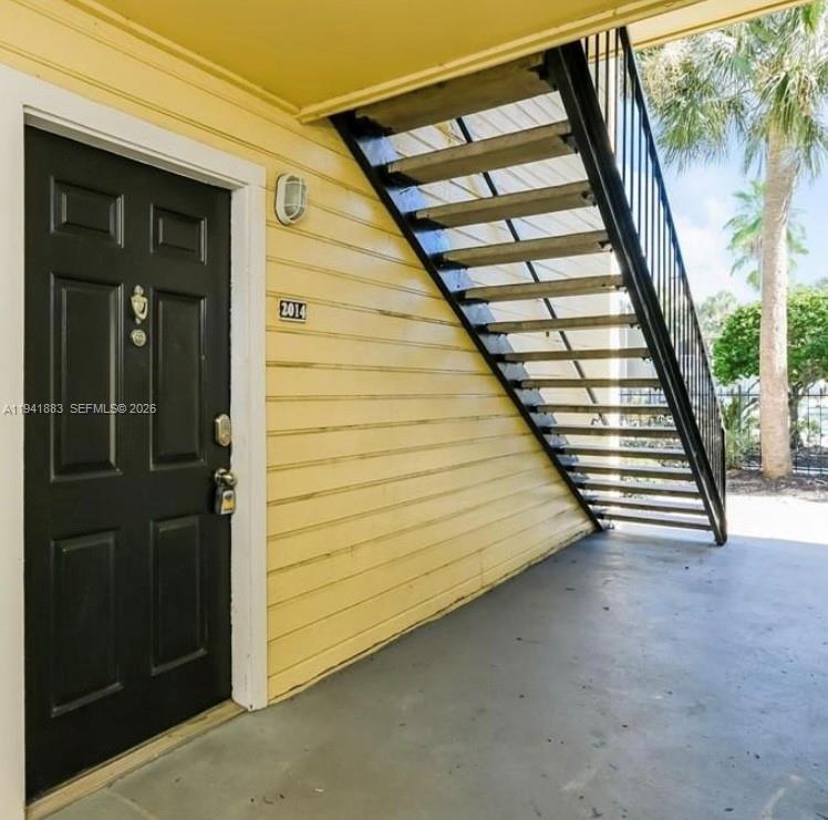 1055 South Hiawassee Road, Unit 2014 Orlando, FL 32835 - Photo 3 of 22 a view of balcony with wooden floor and stairs
