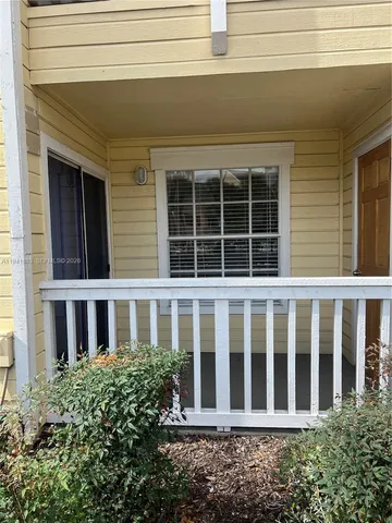 a view of a brick house with windows