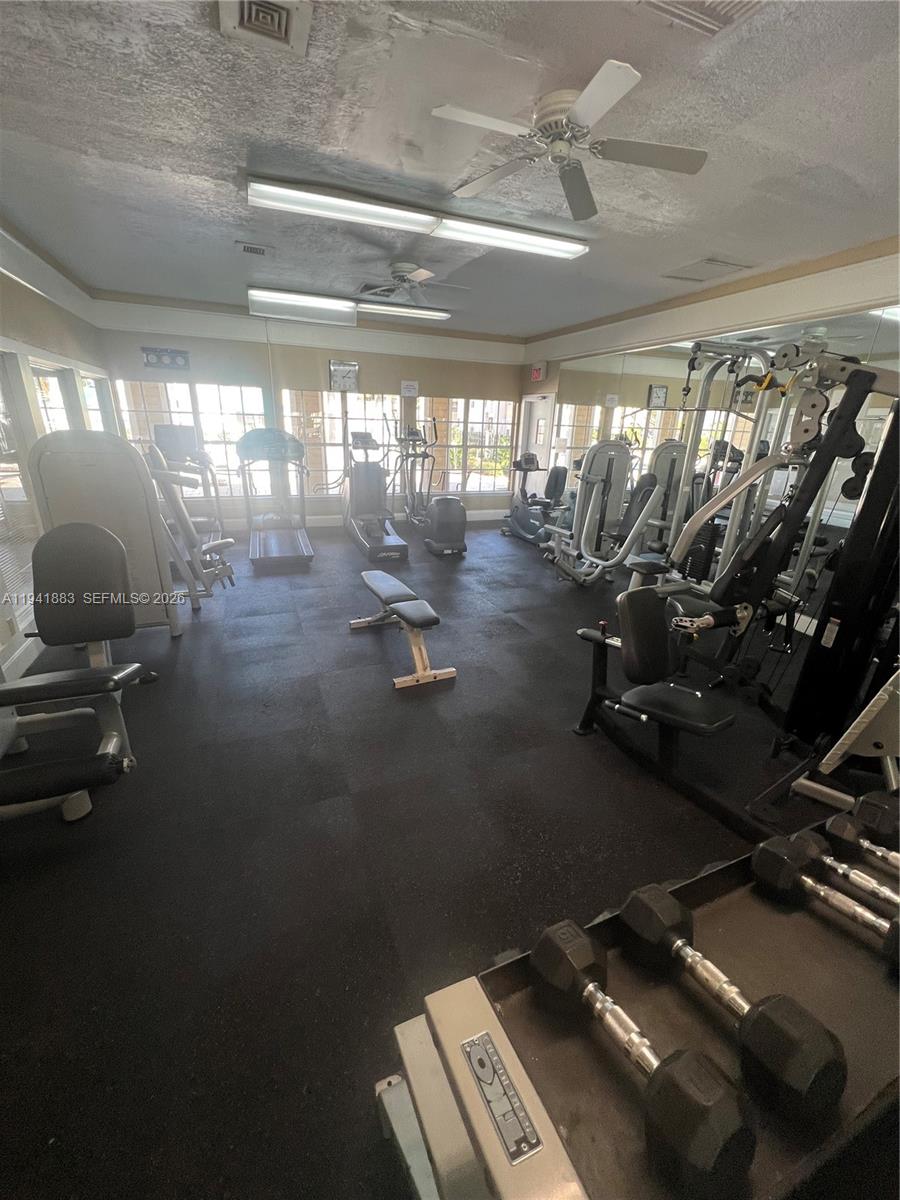 1055 South Hiawassee Road, Unit 2014 Orlando, FL 32835 - Photo 9 of 22 a view of a room with gym equipment
