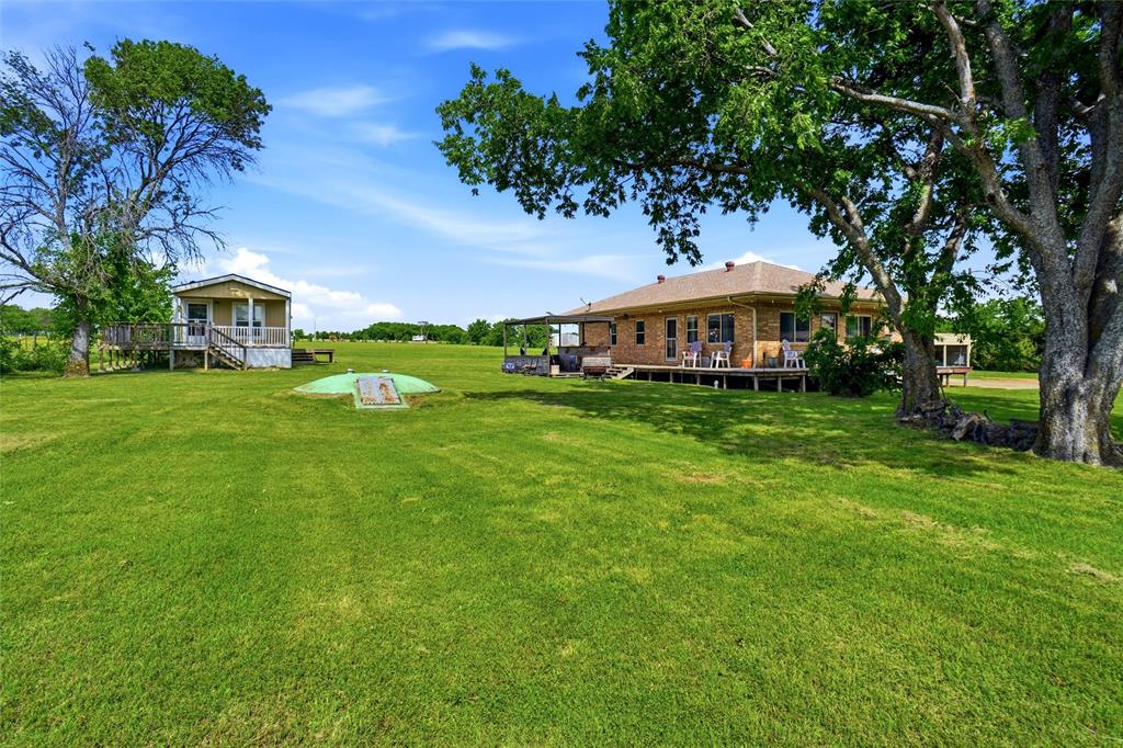 The left hand side of the picuture is house #2. Storm cellar in the center and main house #1 on right hand side of picture.
