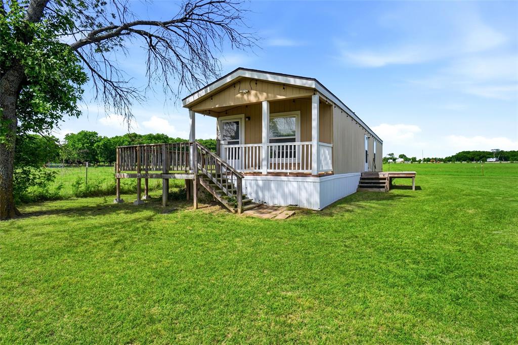 8983 Odneal Road West Krum, TX 76249 - Photo 15 of 29 Mobile home is house#2. The home is not "attached" to the land. It is real property. 2 bedrooms and 2 full bathrooms.