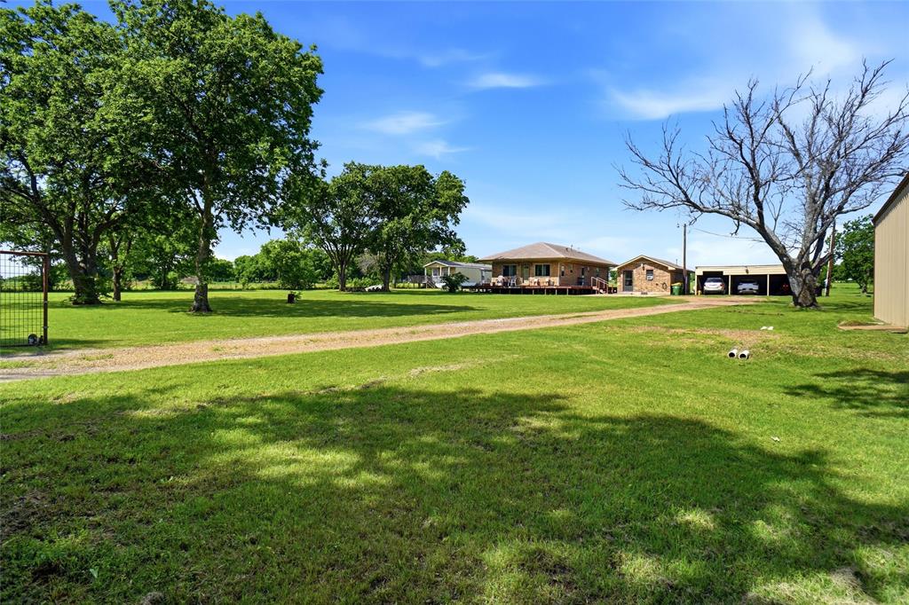 8983 Odneal Road West Krum, TX 76249 - Photo 3 of 29 Property has electric gate. There is a 3 carport structure and shop is on right hand side of the picture.