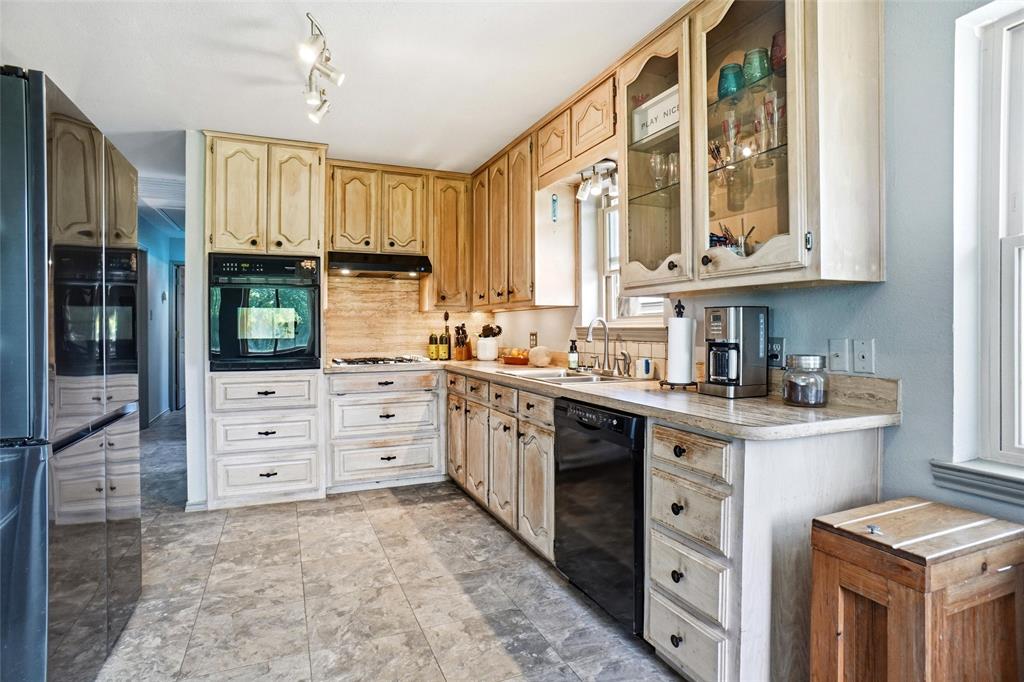 8983 Odneal Road West Krum, TX 76249 - Photo 4 of 29 Kitchen in house #1 with gas stove.