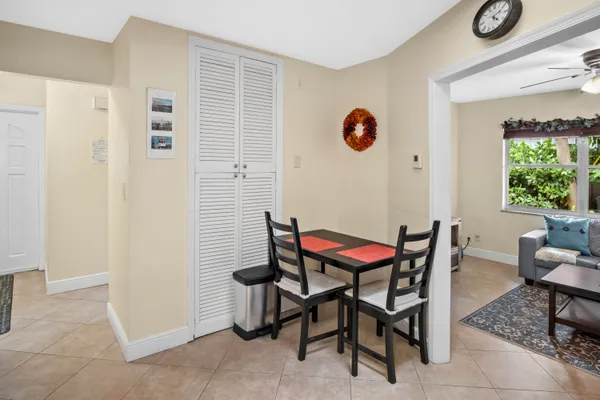 a dining room with furniture and a window