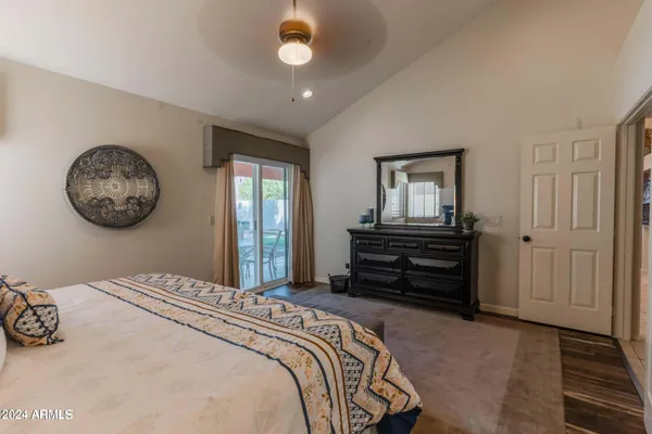 a bedroom with bed and a window
