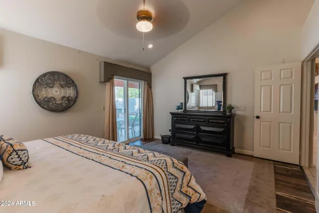 a bedroom with bed and a window