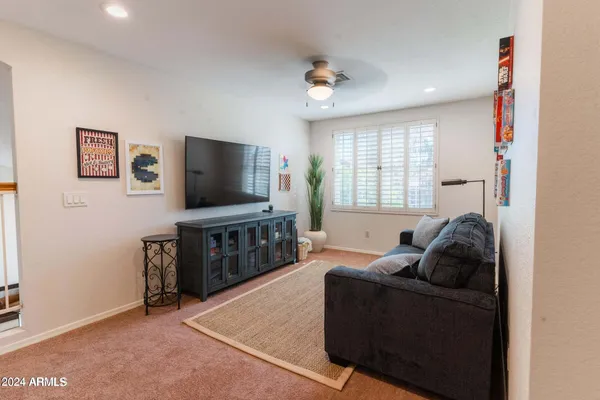 a bedroom with a bed and a couch
