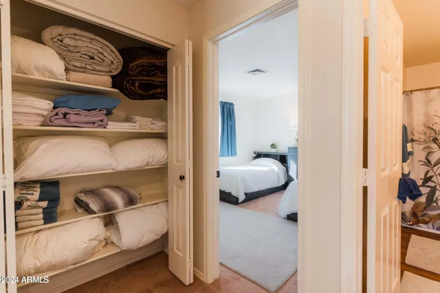 a bedroom with bed and window