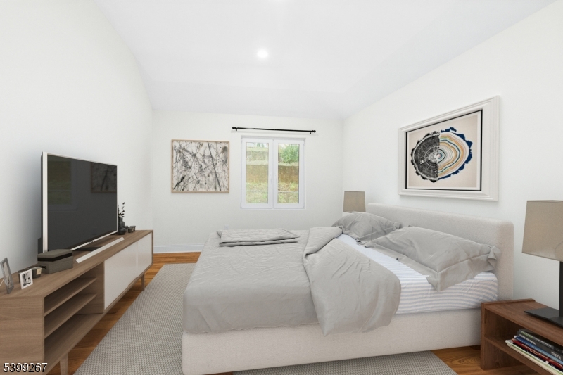 71 St Marys Place, Unit 2 Nutley, NJ 07110 - Photo 11 of 45 a bedroom with a bed and a flat screen tv