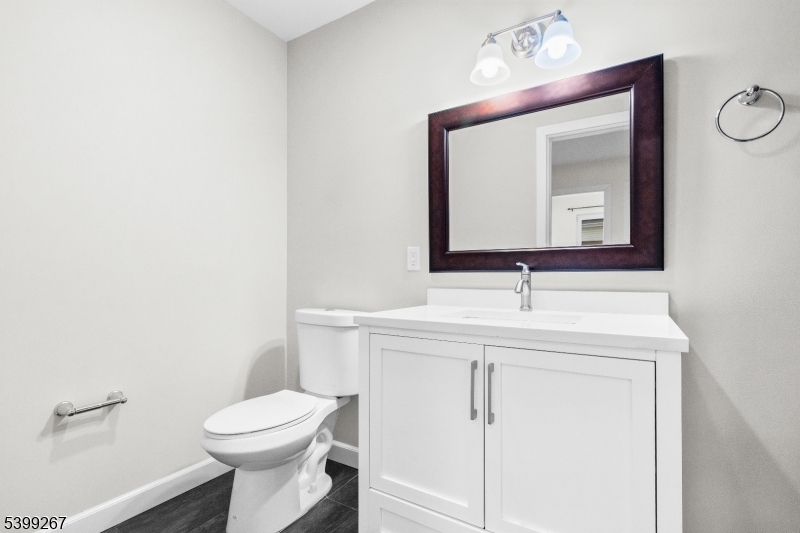 71 St Marys Place, Unit 2 Nutley, NJ 07110 - Photo 17 of 45 a bathroom with a toilet sink and mirror