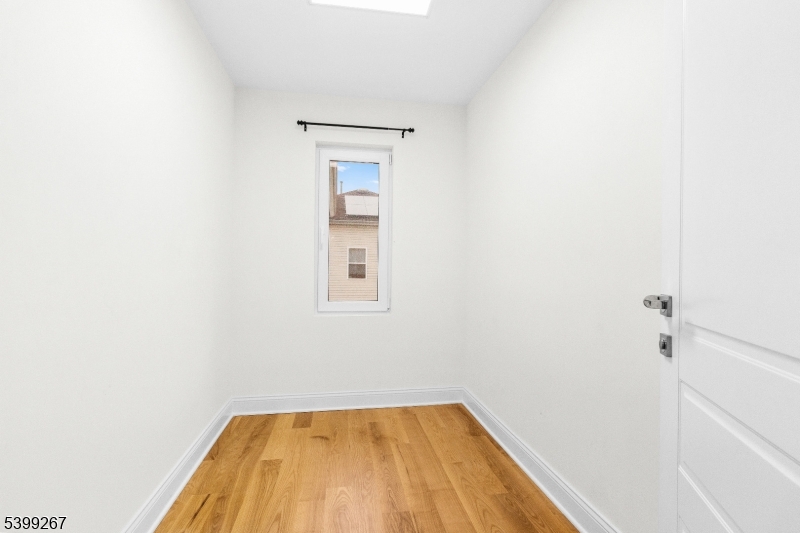 71 St Marys Place, Unit 2 Nutley, NJ 07110 - Photo 18 of 45 a view of a room with wooden floor and a window