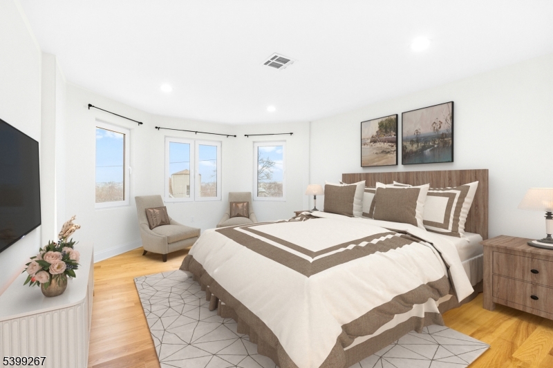 71 St Marys Place, Unit 2 Nutley, NJ 07110 - Photo 7 of 45 a spacious bedroom with a bed and a couch