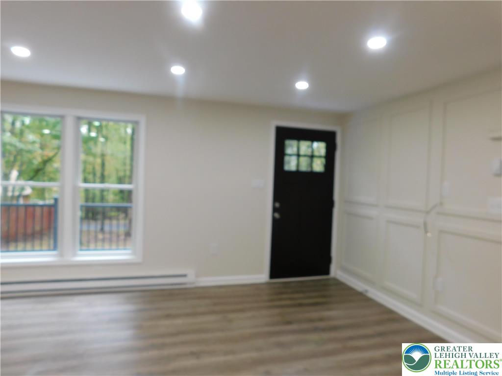 1405 Donalds Road Effort, PA 18330 - Photo 14 of 31 a view of an empty room with wooden floor and a window