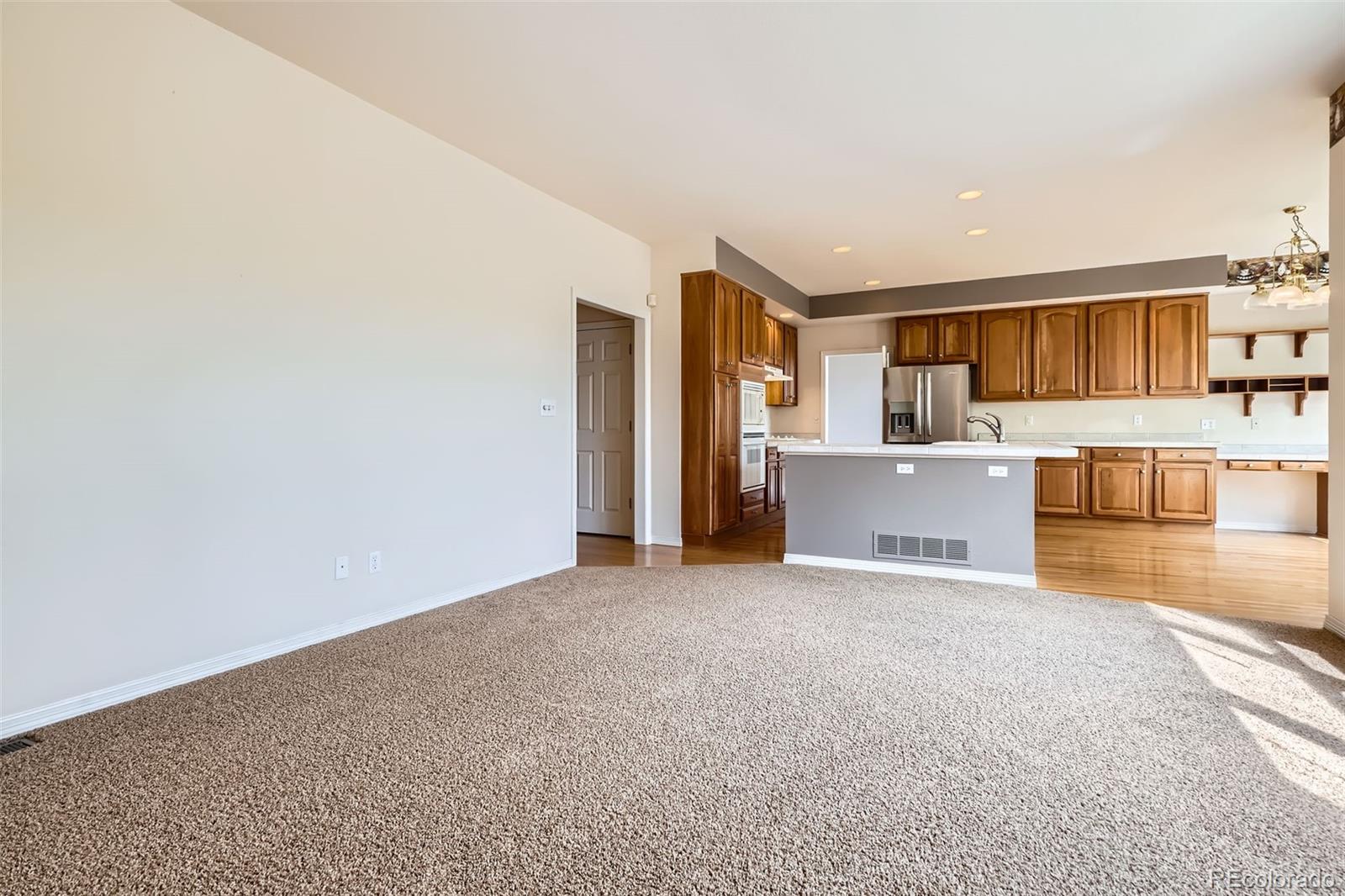 2561 Cactus Bluff Place Highlands Ranch, CO 80129 - Photo 13 of 33 a view of a kitchen with a sink and cabinets