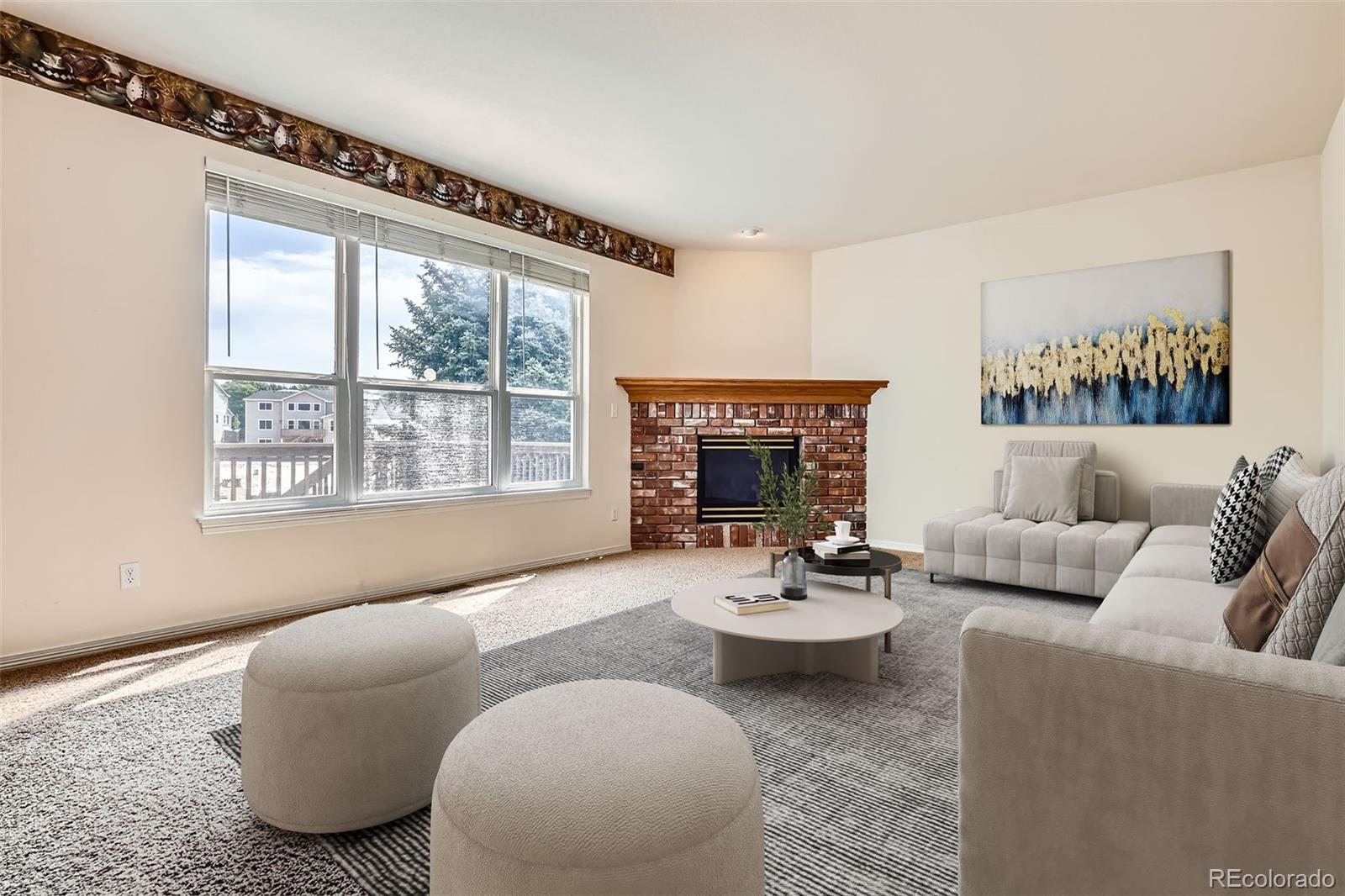 2561 Cactus Bluff Place Highlands Ranch, CO 80129 - Photo 14 of 33 a living room with furniture and a large window