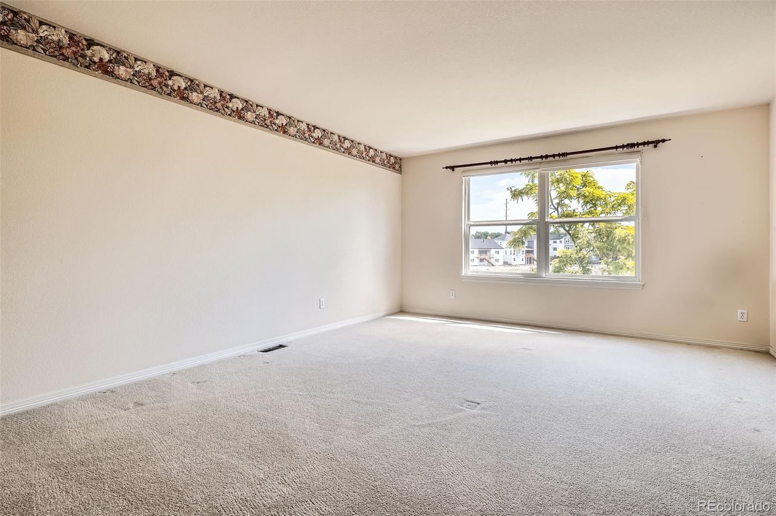 2561 Cactus Bluff Place Highlands Ranch, CO 80129 - Photo 17 of 33 a view of an empty room with a window