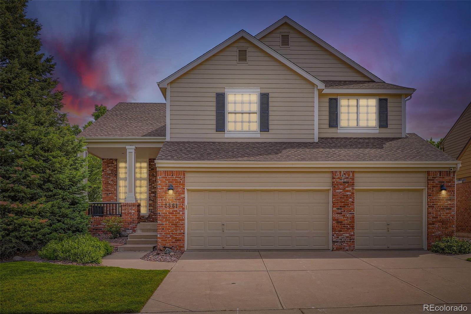 2561 Cactus Bluff Place Highlands Ranch, CO 80129 - Photo 2 of 33 a front view of a house with garage