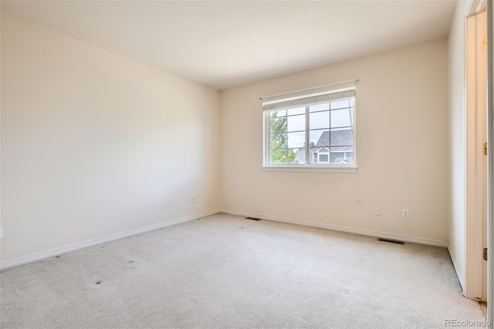 2561 Cactus Bluff Place Highlands Ranch, CO 80129 - Photo 22 of 33 an empty room with a window