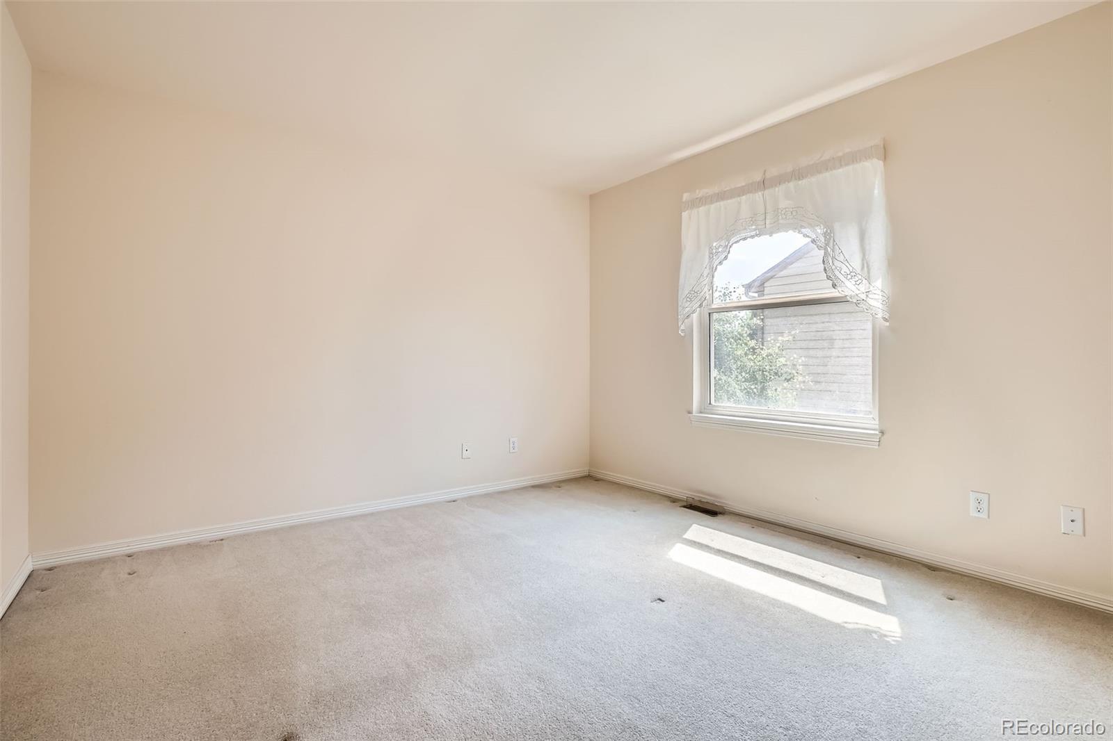 2561 Cactus Bluff Place Highlands Ranch, CO 80129 - Photo 23 of 33 an empty room with a window
