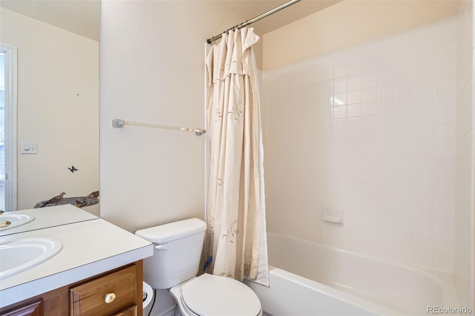 2561 Cactus Bluff Place Highlands Ranch, CO 80129 - Photo 24 of 33 a bathroom with a sink toilet and shower