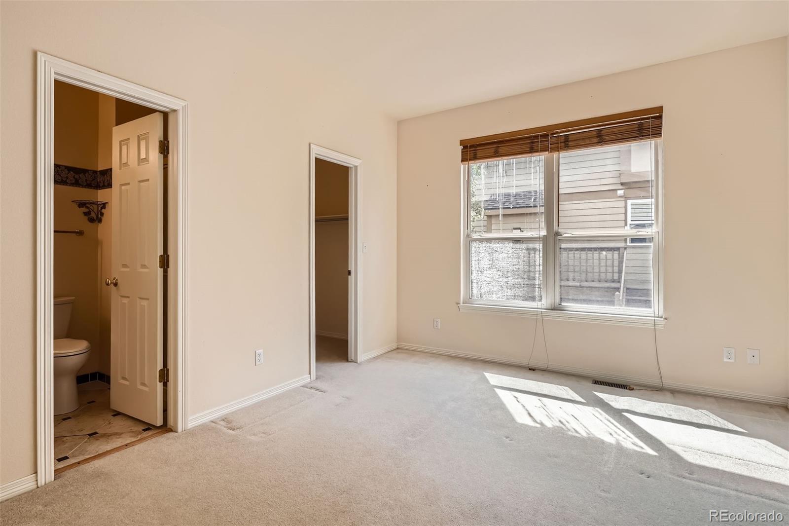 2561 Cactus Bluff Place Highlands Ranch, CO 80129 - Photo 30 of 33 a view of an empty room with closet and a window