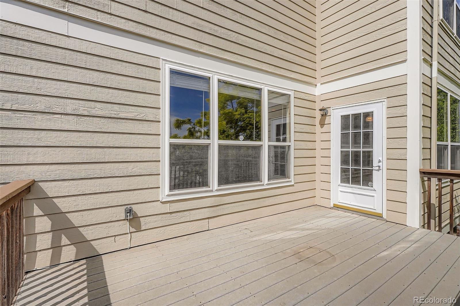 2561 Cactus Bluff Place Highlands Ranch, CO 80129 - Photo 32 of 33 a view of a house with a large window