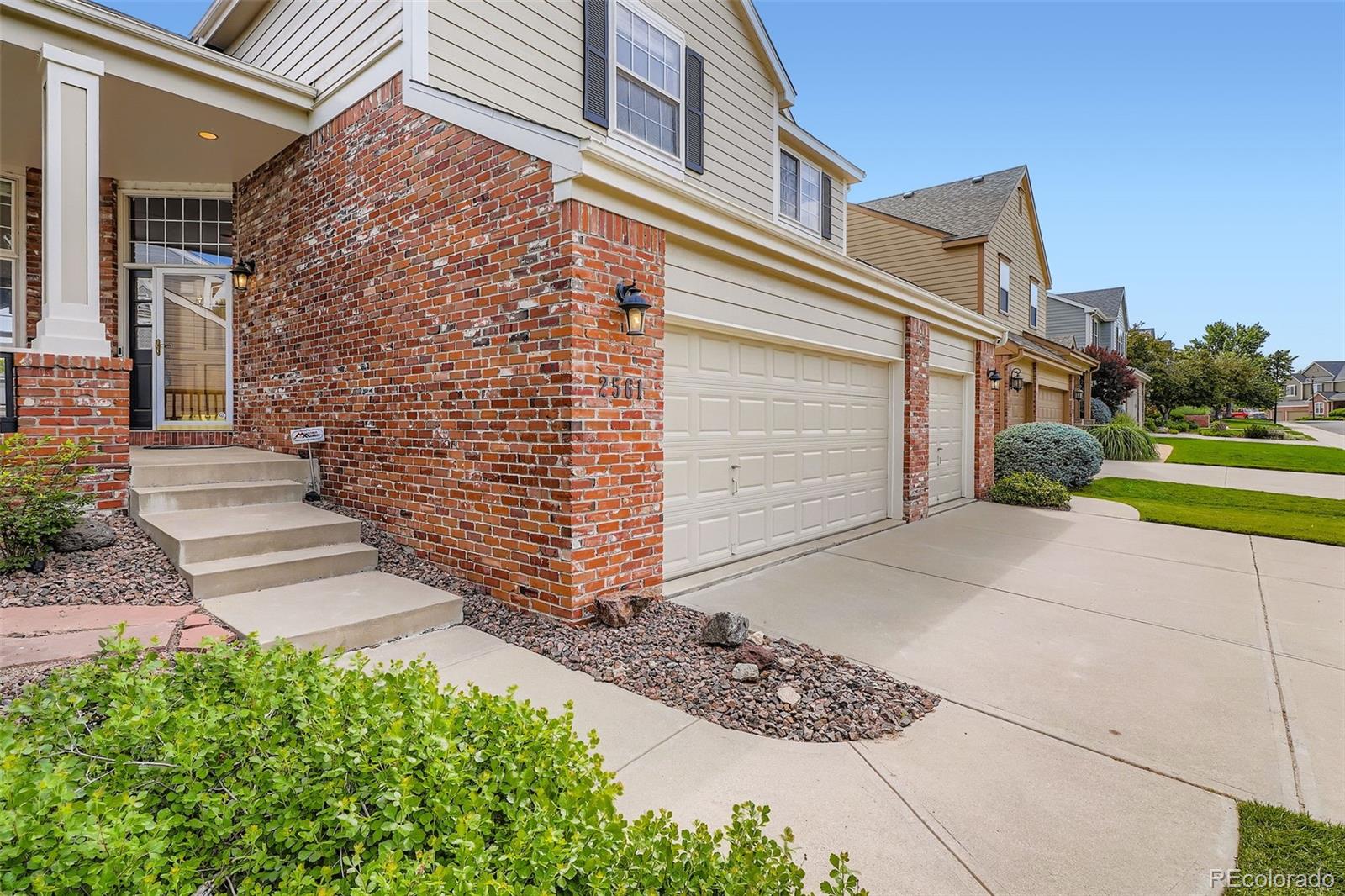 2561 Cactus Bluff Place Highlands Ranch, CO 80129 - Photo 4 of 33 a view of a house with a yard