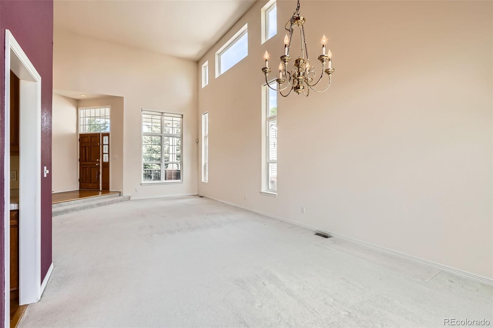 2561 Cactus Bluff Place Highlands Ranch, CO 80129 - Photo 5 of 33 a view of a chandelier in big room and chandelier