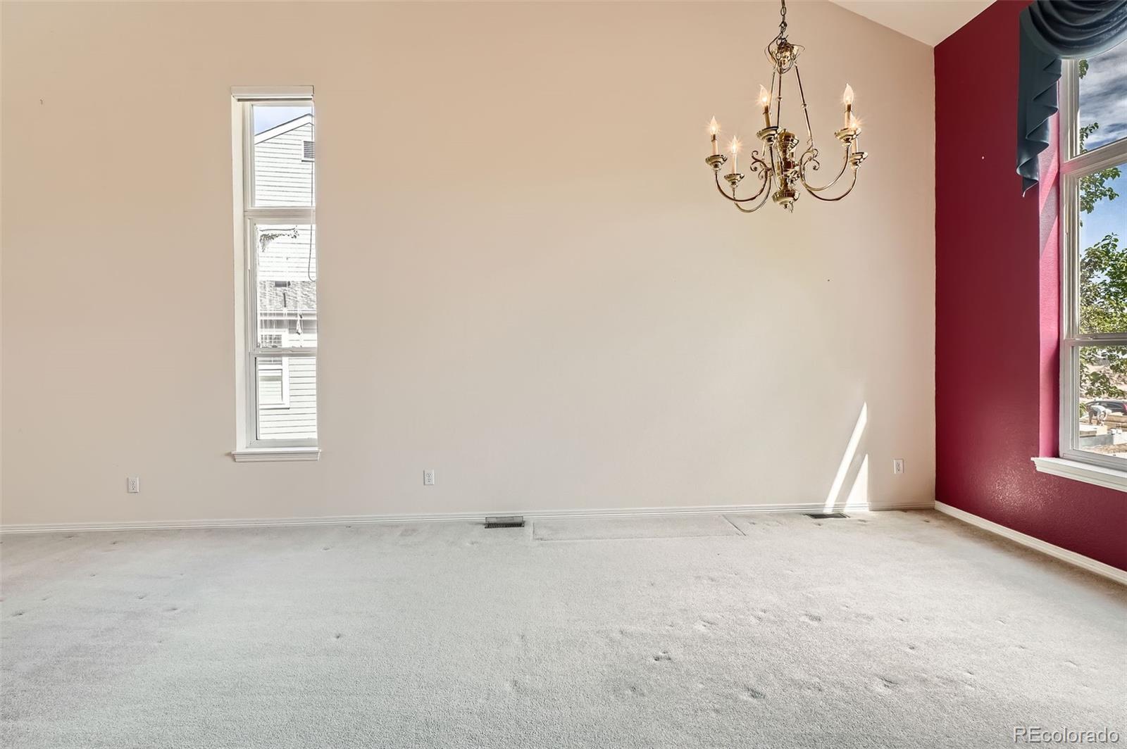 2561 Cactus Bluff Place Highlands Ranch, CO 80129 - Photo 8 of 33 en empty room with windows