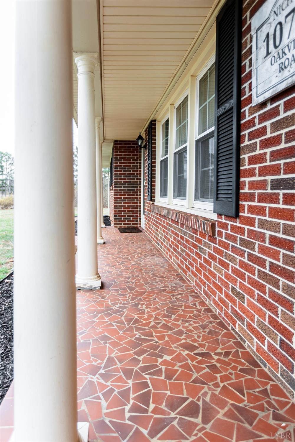10769 Oakville Road Gladstone, VA 24553 - Photo 5 of 35 a view of a brick house with many windows