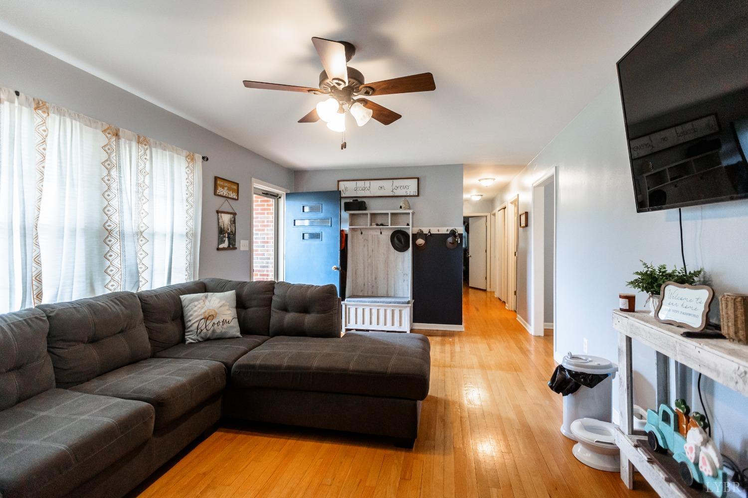 10769 Oakville Road Gladstone, VA 24553 - Photo 9 of 35 a living room with furniture and a flat screen tv