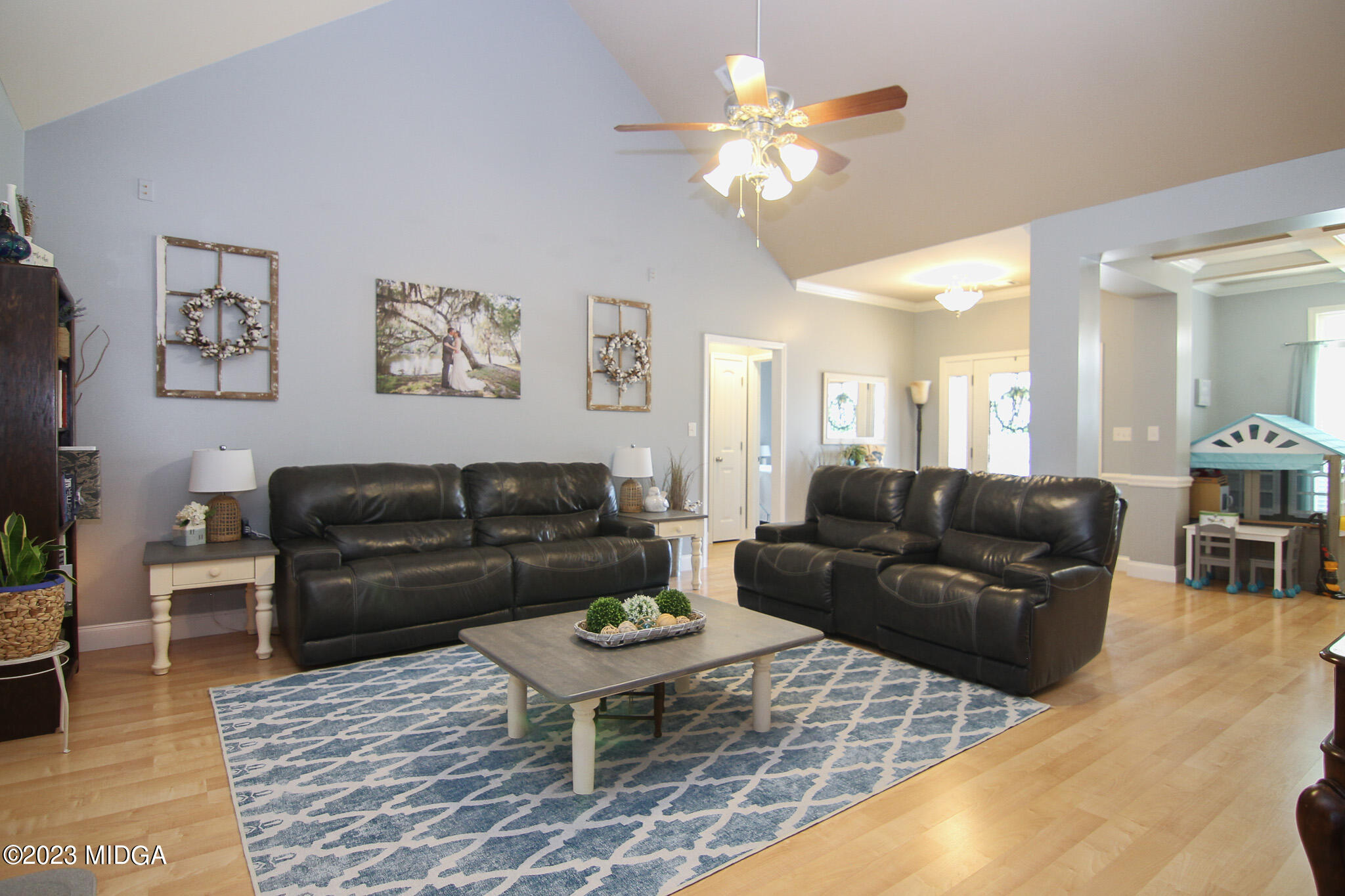 110 Berkley Circle Warner Robins, GA 31093 - Photo 12 of 57 a living room with furniture a table and wooden floor