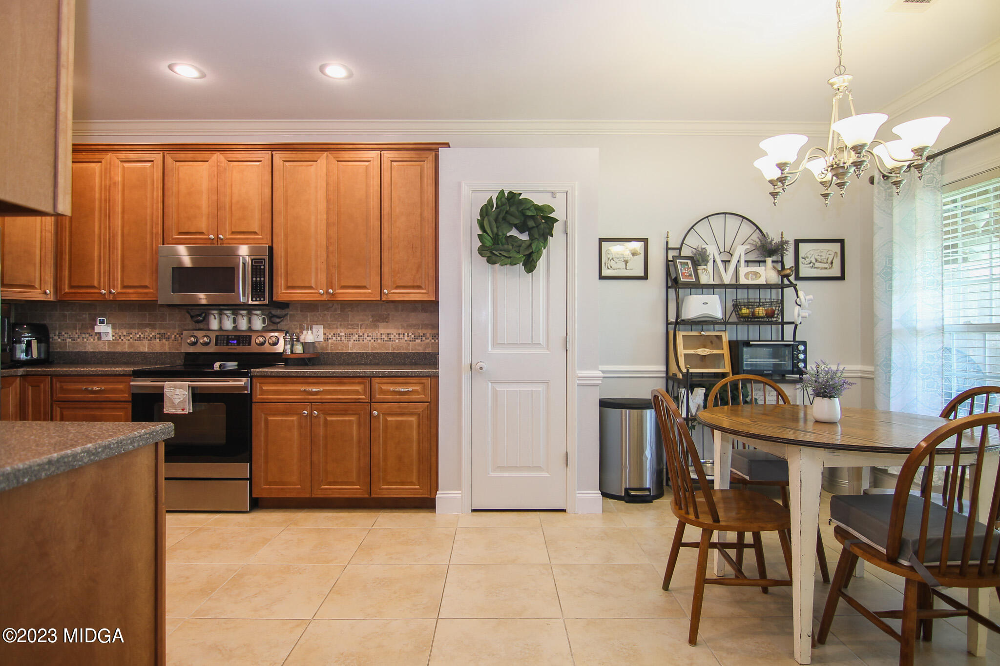 110 Berkley Circle Warner Robins, GA 31093 - Photo 13 of 57 a kitchen with stainless steel appliances granite countertop a stove a sink and a refrigerator