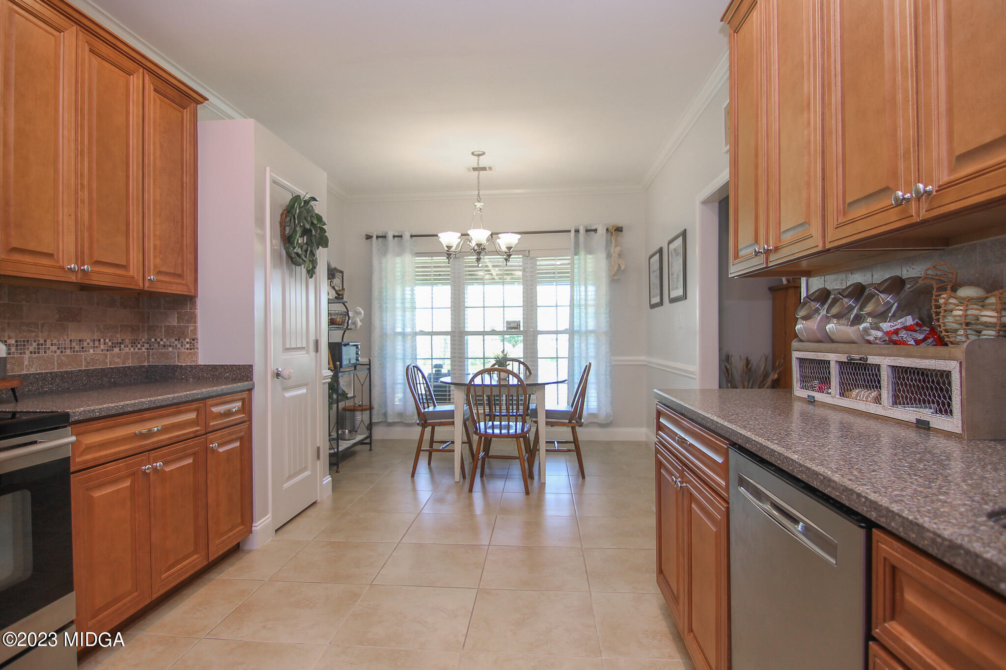 110 Berkley Circle Warner Robins, GA 31093 - Photo 18 of 57 a dining hall with stainless steel appliances granite countertop a stove top oven a sink and dishwasher