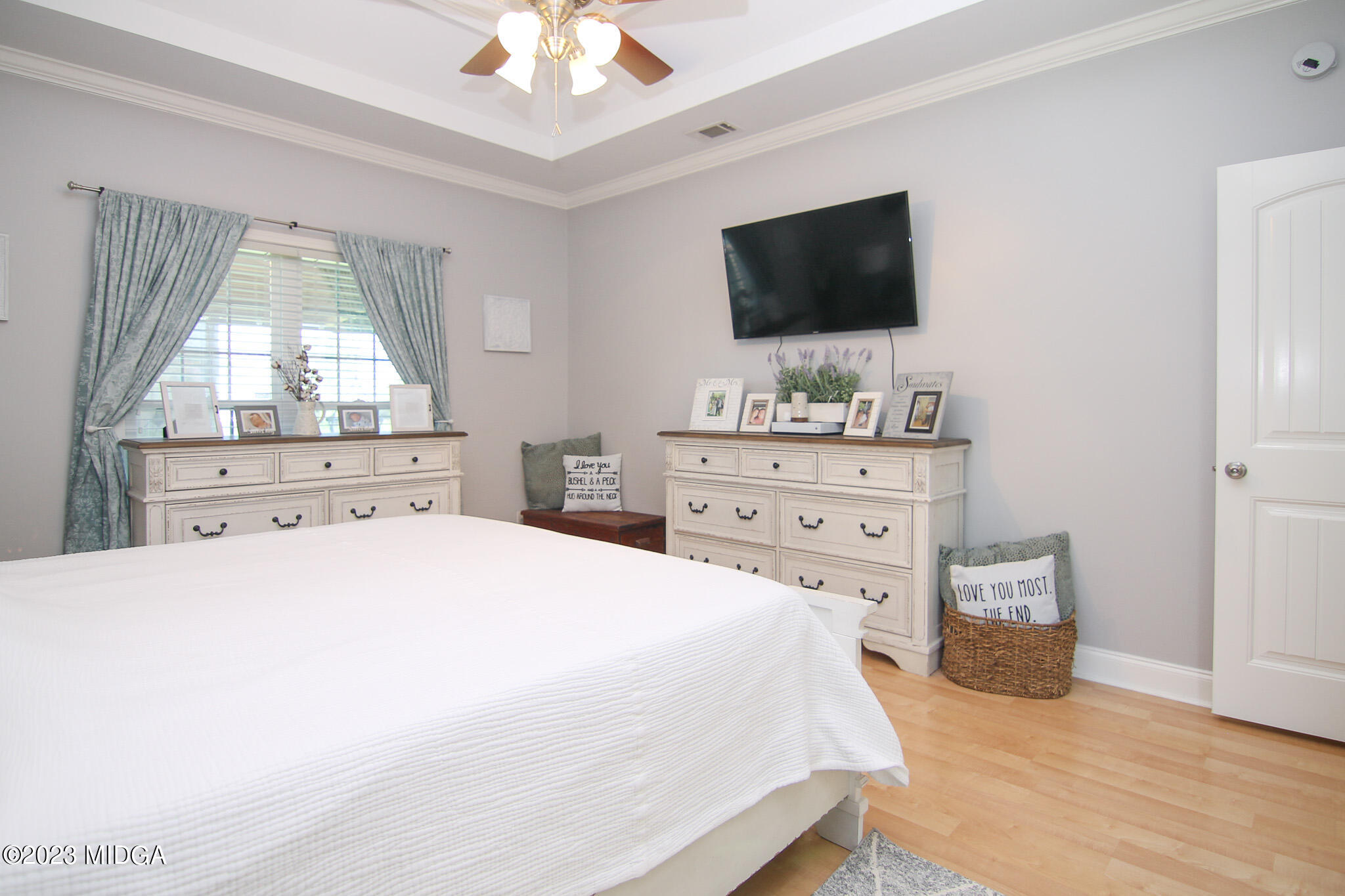 110 Berkley Circle Warner Robins, GA 31093 - Photo 20 of 57 a bedroom with a bed and a flat screen tv