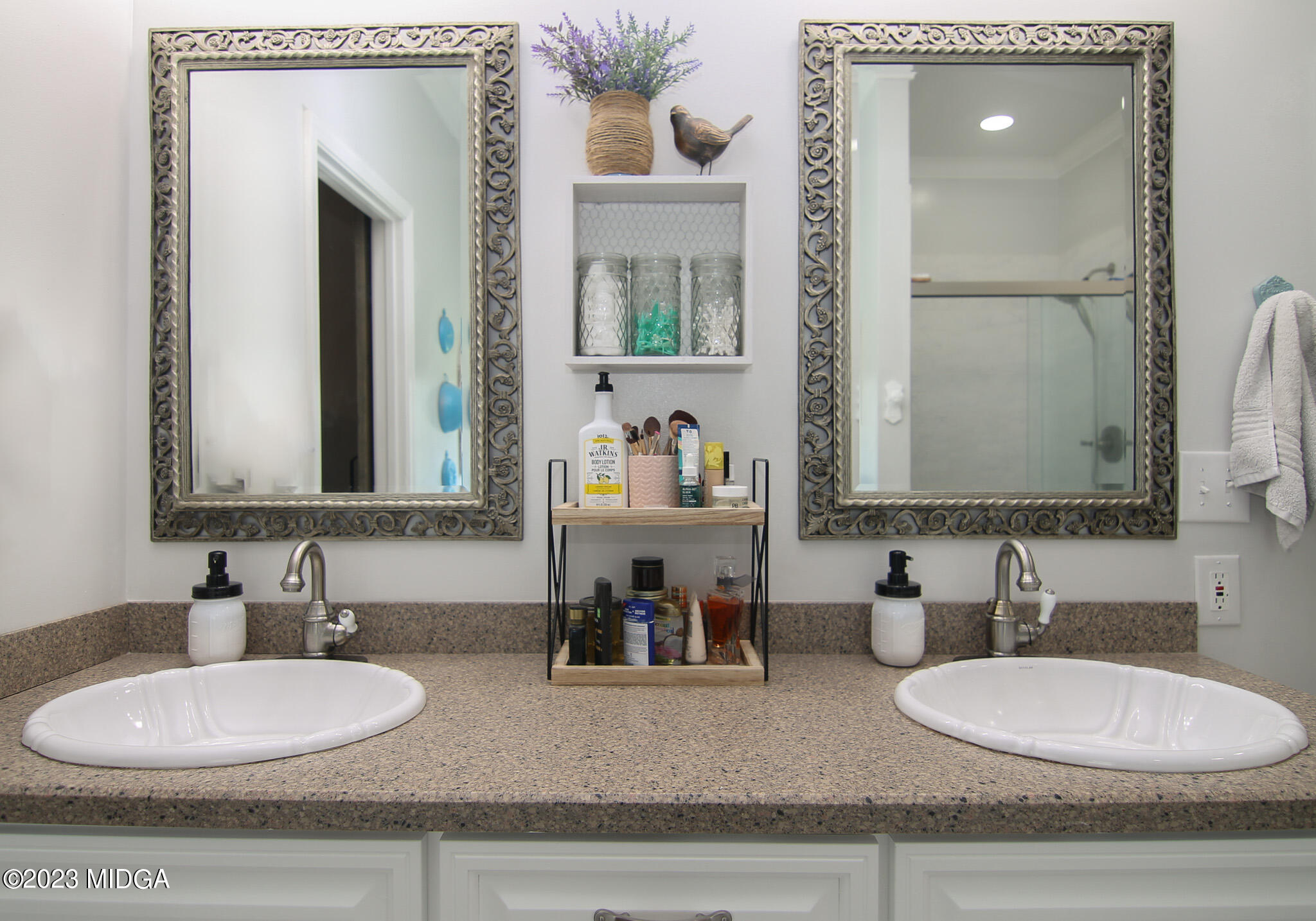 110 Berkley Circle Warner Robins, GA 31093 - Photo 24 of 57 a bathroom with double vanity sinks and a mirror
