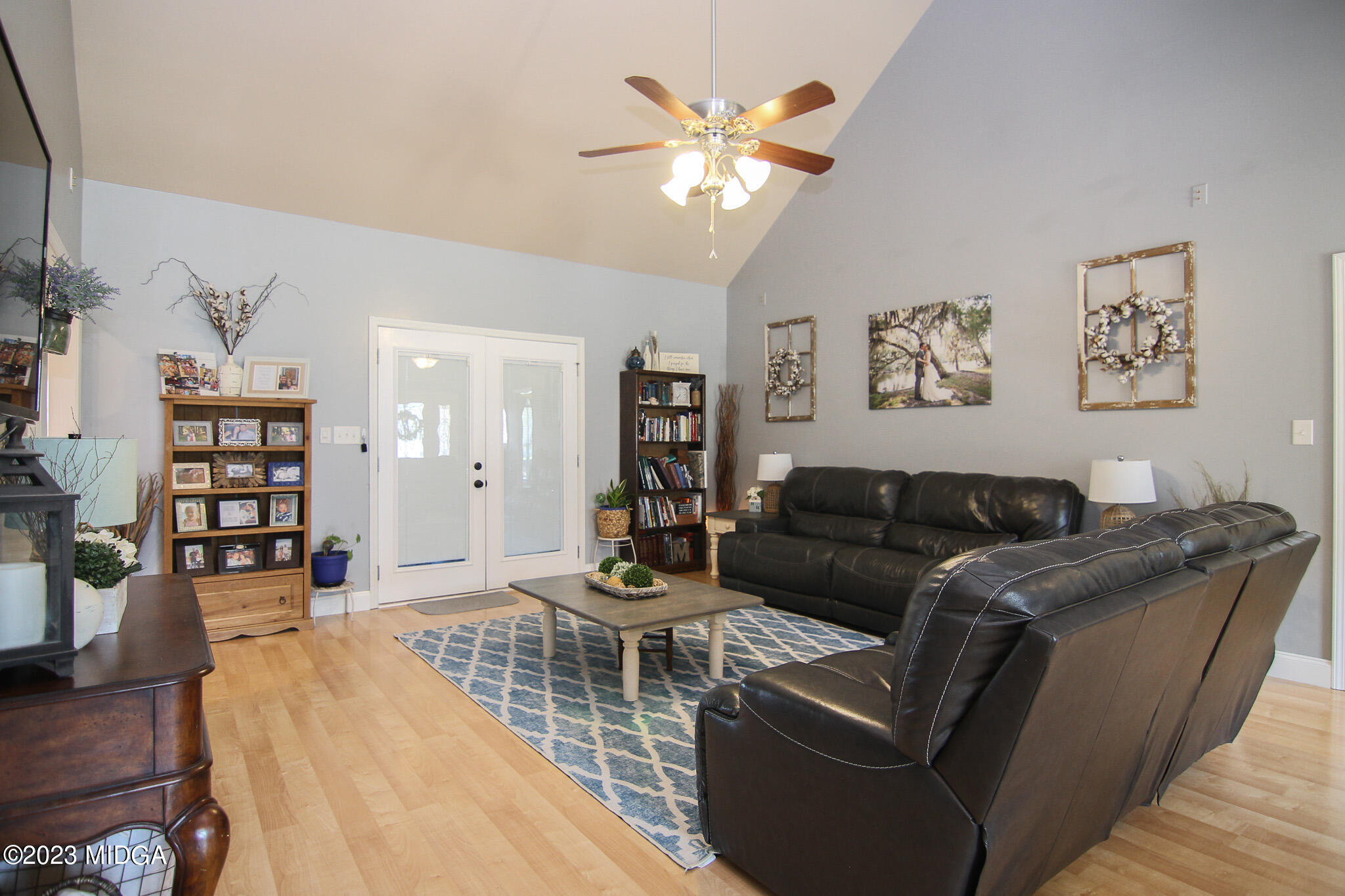 110 Berkley Circle Warner Robins, GA 31093 - Photo 10 of 57 a living room with furniture a view and wooden floor