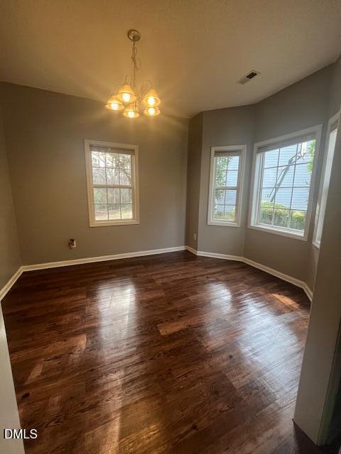 6016 River Lake Circle Raleigh, NC 27604 - Photo 4 of 15 an empty room with wooden floor and windows