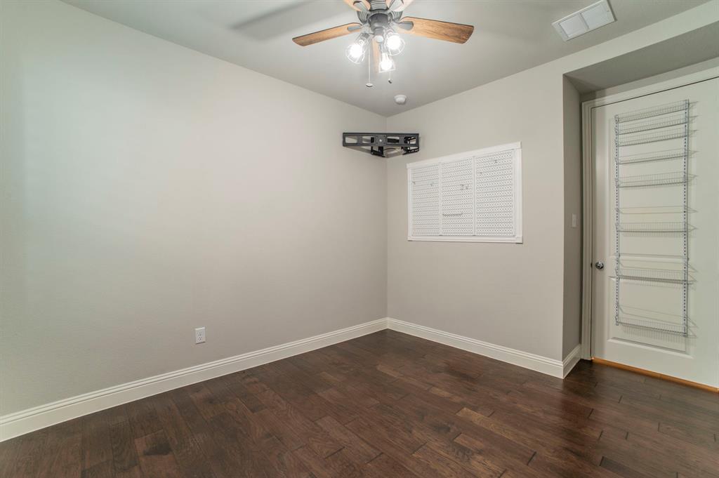 3503 Jersey Road Melissa, TX 75454 - Photo 15 of 40 Unfurnished room featuring dark wood finished floors and a ceiling fan