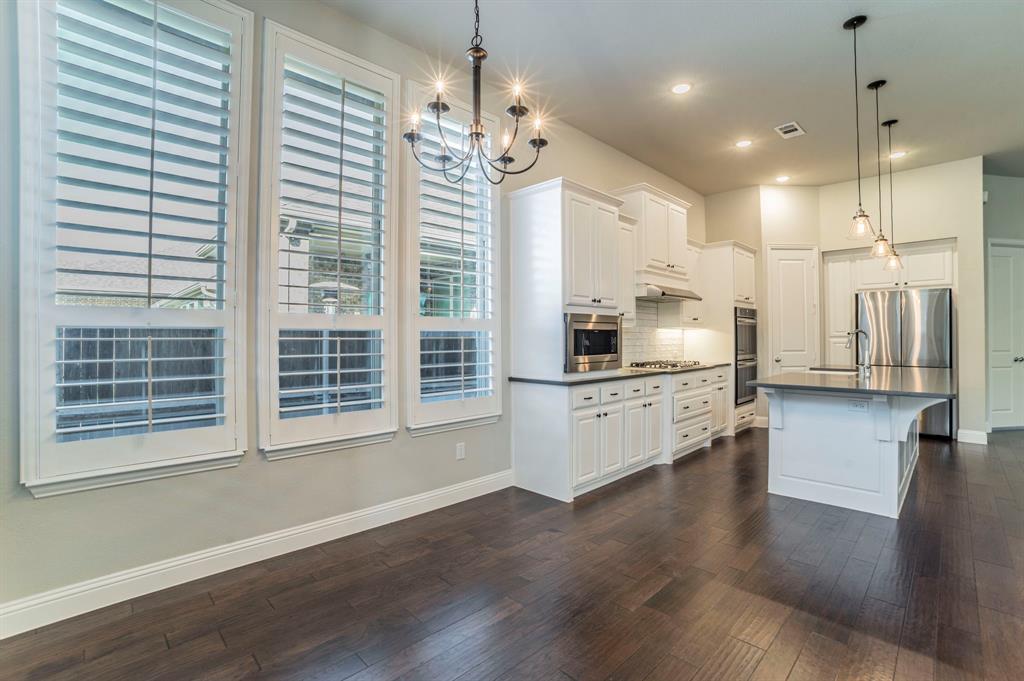 3503 Jersey Road Melissa, TX 75454 - Photo 23 of 40 Kitchen featuring pendant lighting, white cabinets, plenty of natural light, tasteful backsplash, and recessed lighting