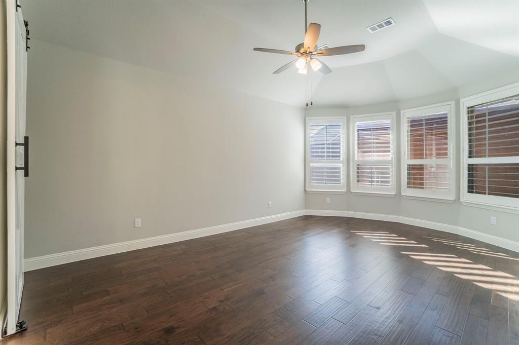 3503 Jersey Road Melissa, TX 75454 - Photo 25 of 40 Empty room featuring vaulted ceiling, dark wood-style floors, and ceiling fan
