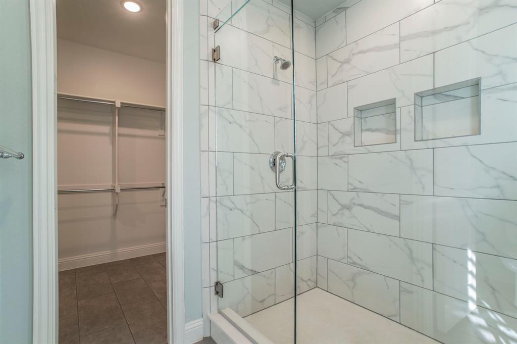 3503 Jersey Road Melissa, TX 75454 - Photo 30 of 40 Full bathroom with a stall shower, a walk in closet, and tile patterned floors
