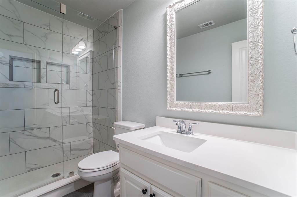 3503 Jersey Road Melissa, TX 75454 - Photo 34 of 40 Full bath with a marble finish shower, a textured wall, and vanity
