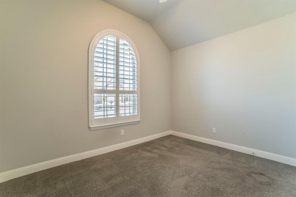 3503 Jersey Road Melissa, TX 75454 - Photo 5 of 40 Spare room featuring dark carpet and lofted ceiling